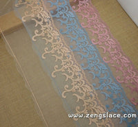 Pink, blue and yellow embroidery on mesh lace, about 7 1/2 inches wide, castteam lace trim, priced for 1 yard. ee-28-x